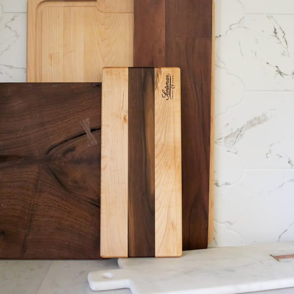 Wood outlet serving tray. Wormy maple and walnut with a rubbed finish.